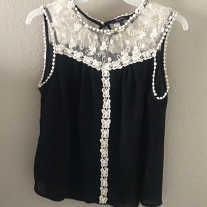 Black top with beautiful white lace details!